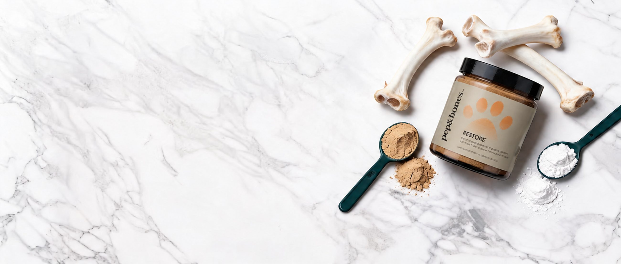 A jar of RESTORE on white marble with bones, loose powder and two measuring scoops.