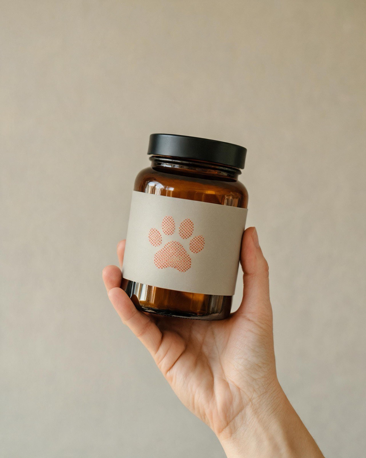 The RESTORE jar held in a hand.